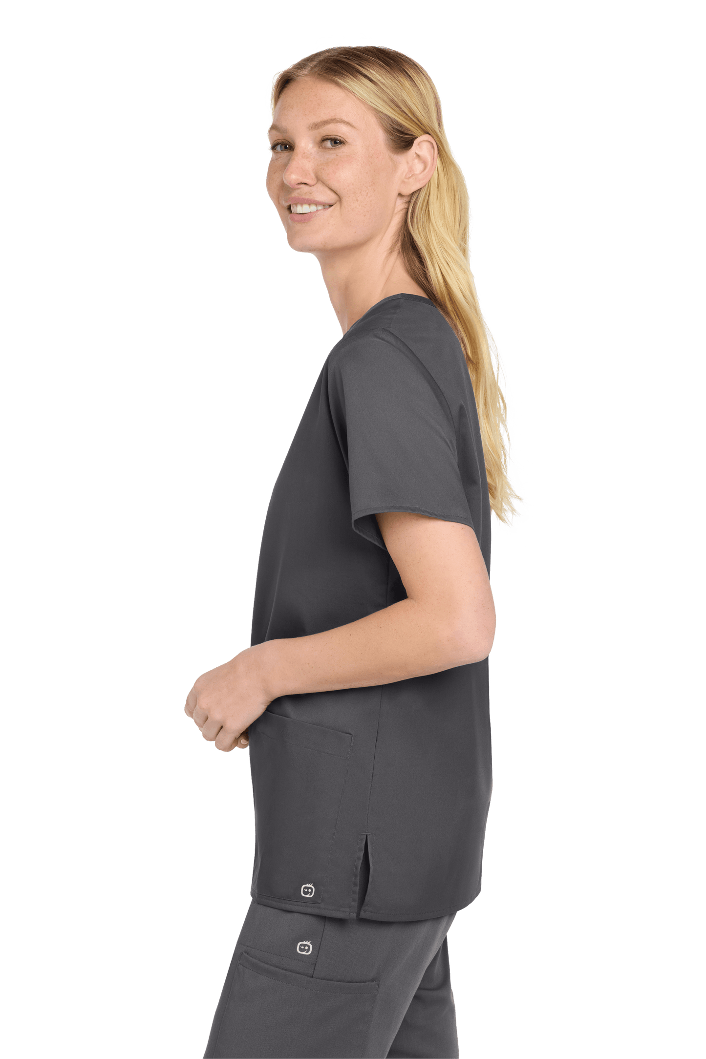 Wink women's medical scrub top with a V-neck and printed design, shown from the side view in pewter grey fabric.