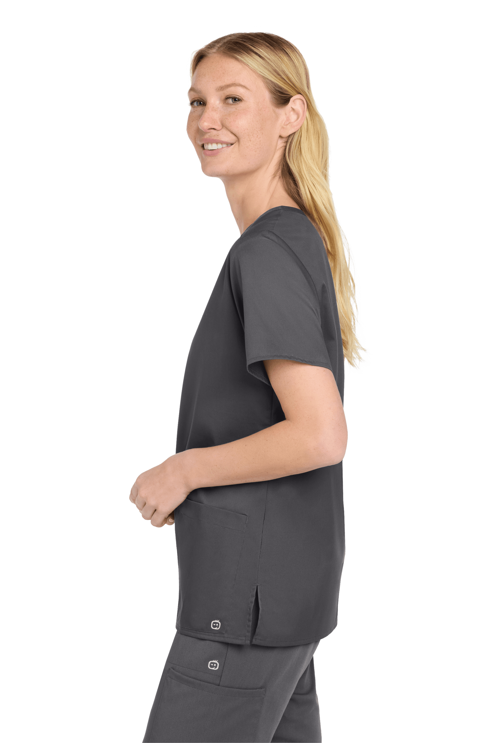 Wink women's medical scrub top with a V-neck and printed design, shown from the side view in pewter grey fabric.
