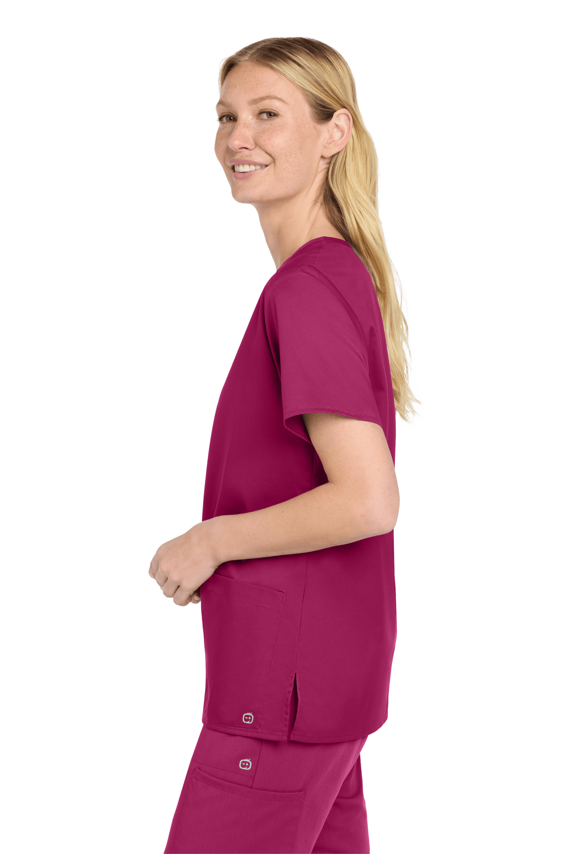 Women’s Wink medical scrub top with a flexible V-neck and printed design, shown from a side view.