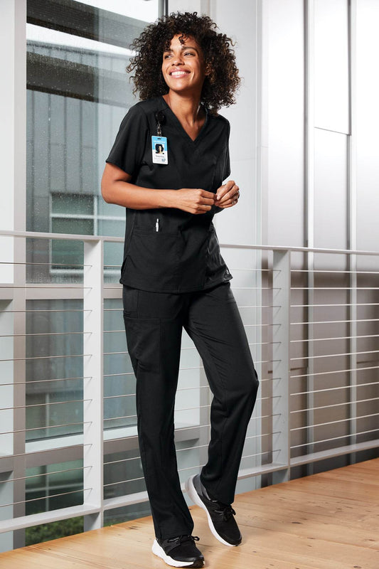 Women’s Premiere Flex Cargo Scrubs by Wink, white medical workwear with practical cargo pockets and a comfortable fit.