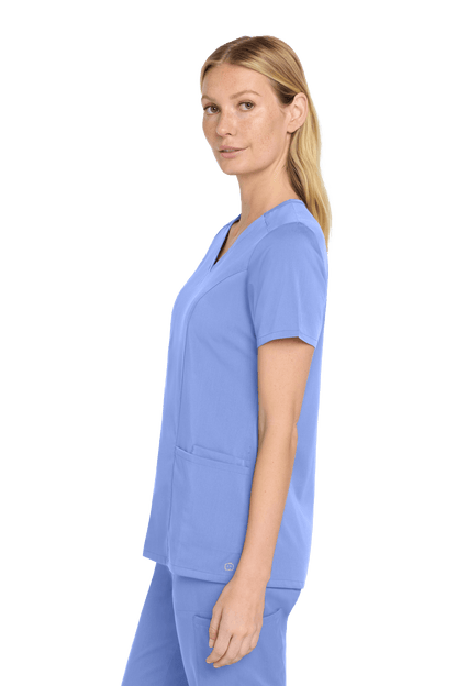 Light blue women's Premiere Flex V-neck scrub top by Wink, shown from the side view with a fitted, comfortable fit.