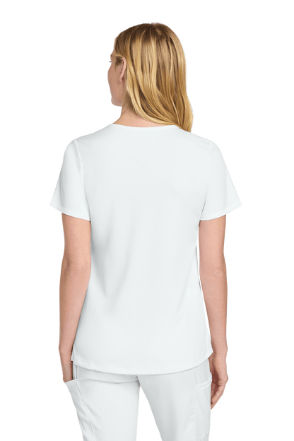 Women’s Wink Premiere Flex V-Neck Scrubs in white, showing the back view with a fitted design and subtle print detail.