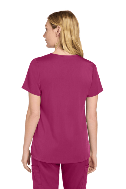 Wink Women’s Premiere Flex V-Neck Scrubs in wine, showing back view with printed design and flexible fabric for comfort.