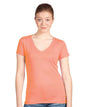 Light orange women's V-neck T-shirt by Next Level Apparel, showcasing a fitted style and smooth fabric.
